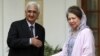 Indian Foreign Minister Salman Khurshid, left, prepares to shake hands with Bangladesh's opposition leader Khaleda Zia as they pose for the media before a meeting in New Delhi, India, October 30, 2012.
