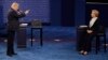 FILE - Then Republican presidential nominee Donald Trump speaks to then Democratic presidential nominee Hillary Clinton during the second presidential debate at Washington University in St. Louis, Missouri, Oct. 9, 2016.