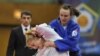 Kayla Harrison of US, in white, fights with Vera Moskalyuk of Russia during the women's under 78 kg category final match at the World Cup Judo tournament in Budapest, Hungary, February 12, 2012.