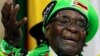 FILE - Former Zimbabwean President Robert Mugabe addresses a meeting of his party's youth league in Harare, Zimbabwe, Oct. 7, 2017. 