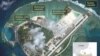 Satellite imagery analysis by geopolitical intelligence firm Stratfor shows overall land, building and military expansion by China on Woody Island in the South China Sea. (Courtesy of Stratfor)