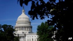 FILE - The sun shines on the U.S Capitol dome, on Capitol Hill in Washington, June 9, 2022.