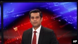 FILE - Senior Pakistani journalist Arshad Sharif oses for photograph prior to recording an episode of his talk show at a studio, in Islamabad, Pakistan, Dec. 15, 2016. 