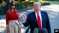 El presidente Donald Trump habló con periodistas el martes, 10 de julio de 2018, antes de abordar el helicóptero presidencial Marine One junto con la primera Dama Melania Trump, en la Casa Blanca, en camino a Bélgica, para una Cumbre de la OTAN.