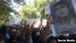 Tehran University students gathered on May 13, 2019, to protest heightened enforcement of mandatory veiling for women during Ramadan and to highlight other concerns such as the May 1, 2019, arrest of journalist Marzieh Amiri, seen pictured on the right.