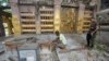 Indian security personnel inspect the site of an explosion inside the Mahabodhi temple complex at Bodh Gaya in the eastern Indian state of Bihar, July 7, 2013. 