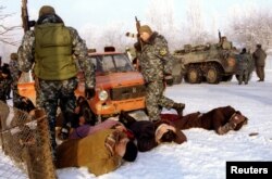 Chechnya -- file -- Russian interior ministry soldiers search the car of Chechenys at a checkpoint near Iskerskaya in Chechnya on December 29. Russian troops are reported to be fighting in Grozny, capital of the rebel region - RTXGBDX
