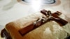 FILE - A crucifix is placed on a cushion in St. Patrick's Cathedral in New York.