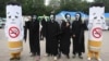 Activists dressed as cigarettes and ghosts stage a campaign marking the World No Tobacco Day in Seoul, South Korea, May 31, 2012. 