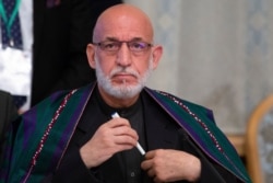 Former Afghan President Hamid Karzai prepares to attend a meeting in Moscow, May 28, 2019.