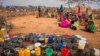 FILE - People wait for food and water to be distributed in the Werder zone of Ethiopia's Somali region, Jan. 28, 2017.