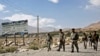 FILE - Afghan border police walk in Ishkashim, Badakhshan province, northeastern Afghanistan, Aug. 16, 2016. Afghan border forces have reportedly reclaimed Arghanj Khwa district in the province from the Taliban.