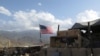 FILE - A U.S. flag is seen at a post in Deh Bala district, Nangarhar province, Afghanistan, July 7, 2018.