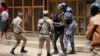 FILE - Ugandan security forces briefly beat then detain a protester in downtown Kampala, Uganda, Aug. 20, 2018. Two women say they were assaulted by Ugandan security officers in an August 13 incident.