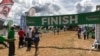 An athlete finishes the Ndalat cross country championship race. Some athletes have come to compete after years of training on their own. (M. Yusuf/VOA)
