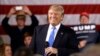 FILE - Republican presidential candidate Donald Trump smiles as he speaks at a campaign stop Tuesday, March 29, 2016.