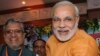 Chief Minister of India’s western state of Gujarat Narendra Modi, right, stands with Bihar state Deputy Chief Minister Sushil Modi, June 9, 2013.