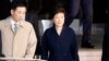 South Korea's ousted leader Park Geun-hye, right, leaves a prosecutor's office in Seoul, March 22, 2017. 