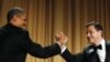 U.S. President Barack Obama shakes hands with comedian Jimmy Kimmel as WHCA President and Reuters correspondent Caren Bohan (C) watches at the White House Correspondents Association annual dinner in Washington, April 28, 2012. 