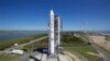 This image provided by NASA shows the Lunar Atmosphere and Dust Environment Explorer aboard a Minotaur V rocket after a rollout at NASA's Wallops Island test flight facility in Wallops Island, Va., Sept. 5, 2013.