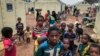 FILE - Children of around 6,000 ethnic Fulanis who have been displaced by attacks, gather in a makeshift camp for the displaced in Youba in Yatenga province in Burkina Faso, April 20, 2020.