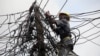 An official of Nigeria Power works on power lines in Lagos, Nigeria, July 22, 2011. 