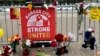 Flowers, signs and other items are seen in front of Union Station in Kansas City, Missouri, Feb. 16, 2024, following a shooting that took place during a Kansas City Chiefs Super Bowl victory rally. 