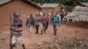 FILE - Anti-Balaka combatants patrol in the parish of Gambo, southeastern Central African Republic, Aug. 16, 2017.