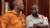 FILE - Suspected LRA (Lords Resistance Army) member Thomas Kwoyelo (R) is pictured during a pre-trial session at the High Court in Kampala on Februay 1, 2017. 