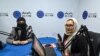 FILE - Station director Saba Chaman, right, and her colleague work in a studio at Radio Begum in Kabul, Afghanistan, Nov. 28, 2021.
