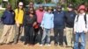 FILE - People with albinism pose with campaigners for their rights in the capital of Lilongwe, Malawi, in early 2016 before the start of street protests against attacks. 
