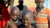 South Sudanese children are pictured at a refugee camp which was inundated by floods from the White Nile near in al-Qanaa in southern Sudan, on Sept. 14, 2021. 