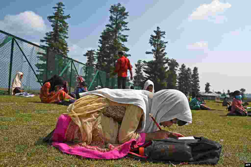 Students attend a class at their open-air school situated on top of a mountain in Doodhpathri, Indian-administered Kashmir, July 27, 2020.&nbsp;Schooling in restive Kashmir has been severely disrupted by the pandemic.
