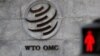 FILE - A logo is pictured outside the World Trade Organization (WTO) headquarters next to a red pedestrian traffic light, in Geneva, Switzerland, Oct. 2, 2018.