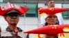 Protesters wearing boat-shaped paper hats and mock missiles, join others in a rally at the Chinese Consulate to protest China's alleged continued militarization of the disputed Spratly Islands in the South China Sea Feb. 10, 2018.