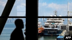 Security personnel guard the entrance to the new Panama Cruise Terminal in Panama City, on March 26, 2024.