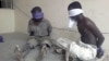 Suspected members of the radical Islamist sect Boko Haram are detained by the military in Bukavu Barracks in Kano state, Nigeria, March 21, 2012. 