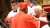 Pope Benedict XVI greets new Cardinal John Olorunfemi Onaiyekan of Nigeria during a consistory ceremony in Saint Peter's Basilica at the Vatican November 24, 2012.