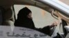 FILE - A woman drives a car on a highway in Riyadh, Saudi Arabia, as part of a campaign to defy Saudi Arabia's ban on women driving, March 29, 2014. Women's rights activists are among those being detained in Saudi Arabia. 