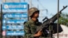 ទាហ៊ាន​ថៃ​ម្នាក់​នេះ ប្រុង​​កាំភ្លើង​យន្ត​គ្រាដែល​អង្គភាព​របស់​លោក​ចូល​កាន់កាប់​ភាគកណ្តាល​ក្រុងបាងកក​នៅ​ថ្ងៃ​ទី​២០ ខែឧសភា ឆ្នាំ២០១៤។