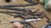 Confiscated weapons are displayed after a military raid on a hideout of suspected Islamist Boko Haram members in Nigeria's northern city of Kano, August 11, 2012.