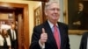 Senate Majority Leader Mitch McConnell of Kentucky signals a thumbs-up as he leaves the Senate chamber on Capitol Hill in Washington, April 6, 2017, after he led the GOP majority to change Senate rules and lower the vote threshold for Supreme Court nominees from 60 votes to a simple majority in order to advance Neil Gorsuch to a confirmation vote.