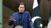 In this photo released by the official website of the office of the Iranian Presidency, Pakistani Prime Minister Imran Khan speaks at a joint press conference with Iranian President Hassan Rouhani in Tehran, Oct. 13, 2019. 