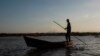 A fisherman stands on his boat as he fishes at the Tisma lagoon wetland park, also designated as Ramsar Site 1141 in the Convention on Wetlands, in Tisma, Nicaragua, April 18, 2018.