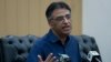 Pakistan's Finance Minister Asad Umar addresses a news conference in Islamabad, Pakistan, April 18, 2019. 