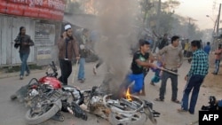 Bangladeshi Islamist activists vandalize motor bikes in Barisal, some 142 kms south the capital Dhaka, March 4, 2013.