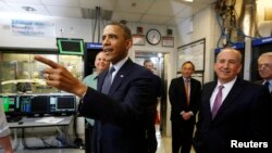 U.S. President Barack Obama tours the Argonne National Lab near Chicago, March 15, 2013. Obama traveled to Chicago on Friday for an event where he will propose diverting $2 billion in revenue from federal oil and gas leases to pay for research on advanced
