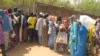 FILE- Cameroonian internally displaced queue for food aid at a camp in the extreme north of Cameroon, Feb. 22, 2017. Boko Haram attacks since August 2020 have displaced at least 7,000 people, Cameroon authorities say.