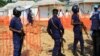 Police officers stand guards at a newly established Ebola response center in Beni, Democratic Republic of Congo, Aug. 10, 2018. 