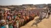 FILE - Rohingya children and refugees raise their hands and shout that they won't go back to Myanmar during a demonstration at Kutupalong near Cox's Bazar, Bangladesh, Jan. 22, 2018. 